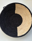 The display of black and natural color handwoven bowl