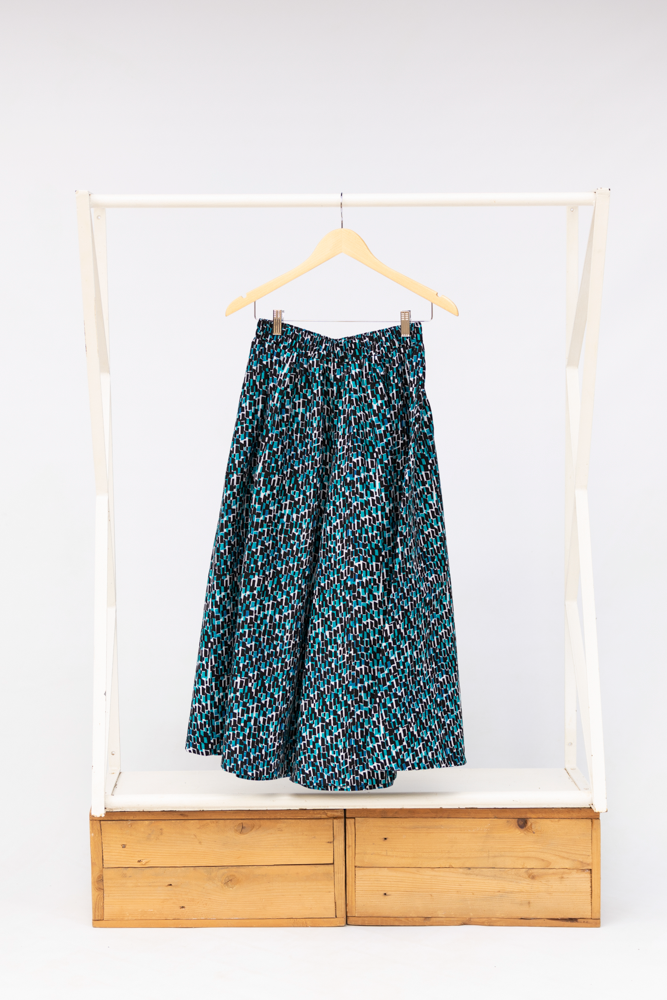 Display of aqua, black and white culottes.