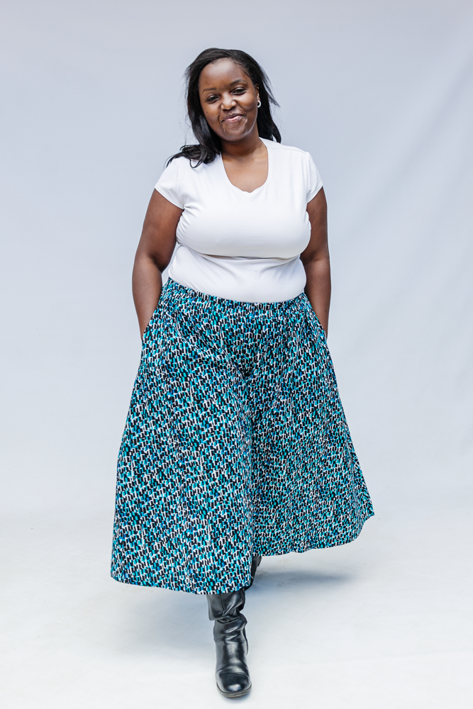 Model wearing aqua, black and white culottes.