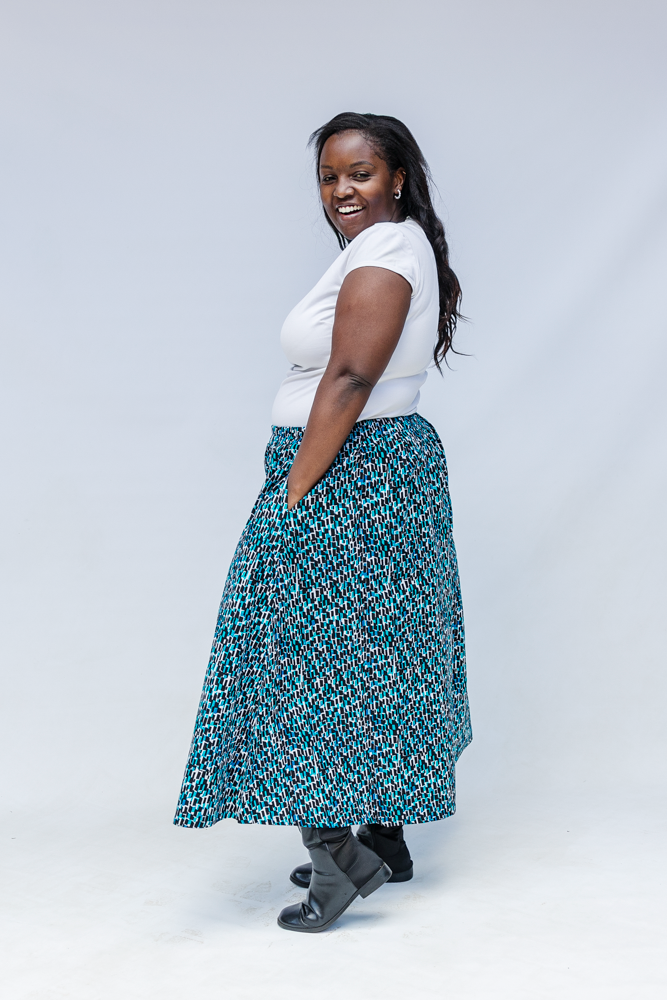Model wearing aqua, black and white culottes.