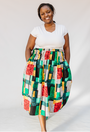 Model wearing multicolored geometric print skirt.