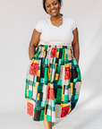 Model wearing multicolored geometric print skirt.