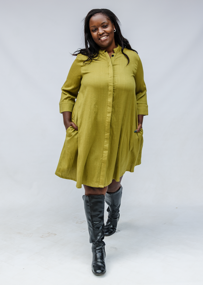 Model wearing olive green linen dress.