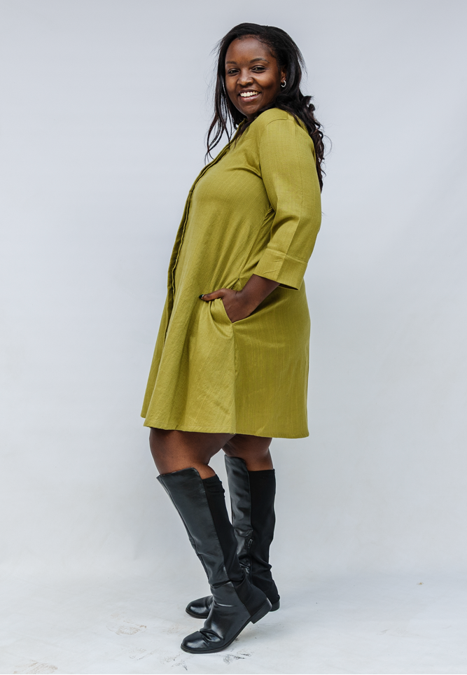 Model wearing olive green linen dress.