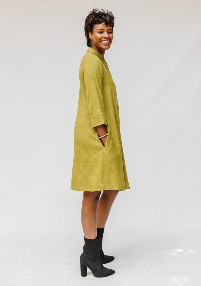 Model wearing olive green linen dress.