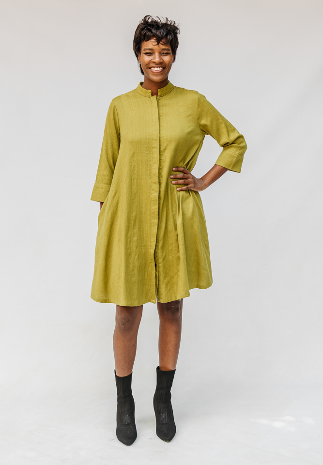 Model wearing olive green linen dress.
