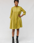 Model wearing olive green linen dress.