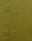 Close up display of olive green linen dress, fabric.