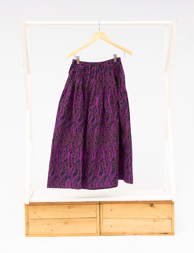 Display of fuchsia skirt with small dot design.