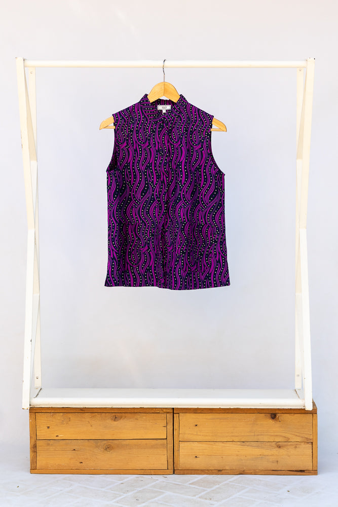 Display of purple and black abstract print sleeveless shirt.