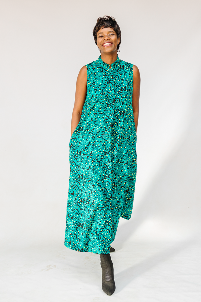 Model wearing teal floral maxi dress.