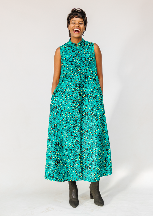 Model wearing teal floral maxi dress.