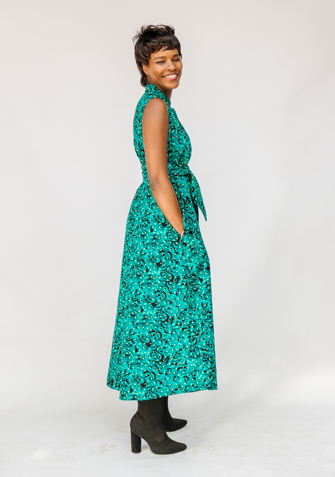 Model wearing teal floral maxi dress.