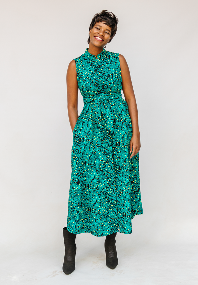 Model wearing teal floral maxi dress.