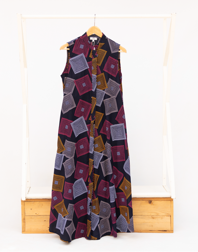 Display of pink, orange, white and black geometric print dress.