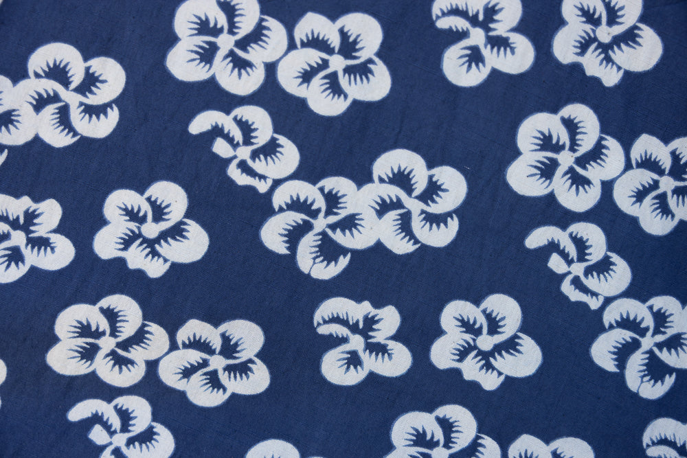 Close up display of blue and white floral dress, fabric.