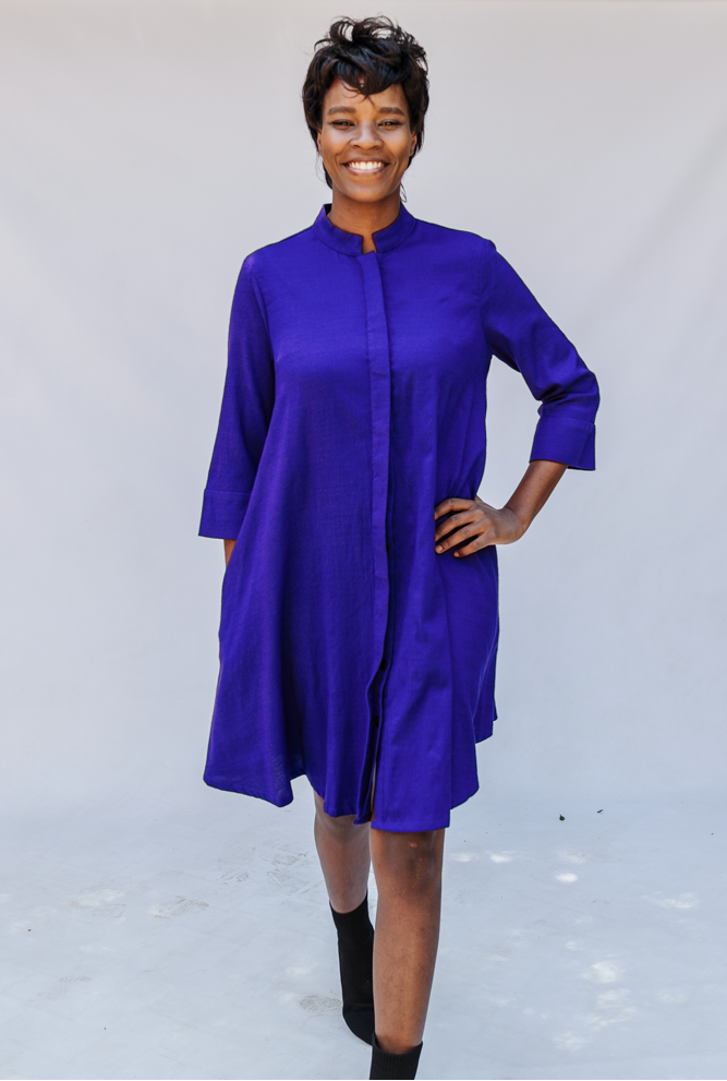 Model wearing deep blue linen dress.