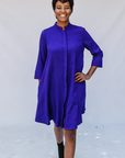 Model wearing deep blue linen dress.
