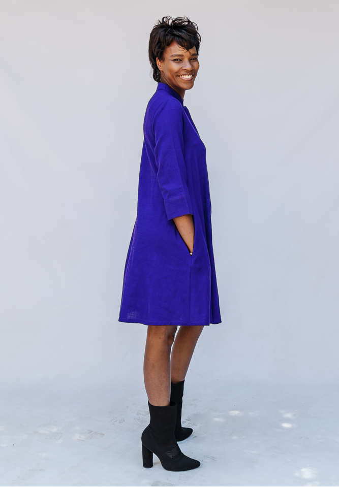 Model wearing deep blue linen dress.