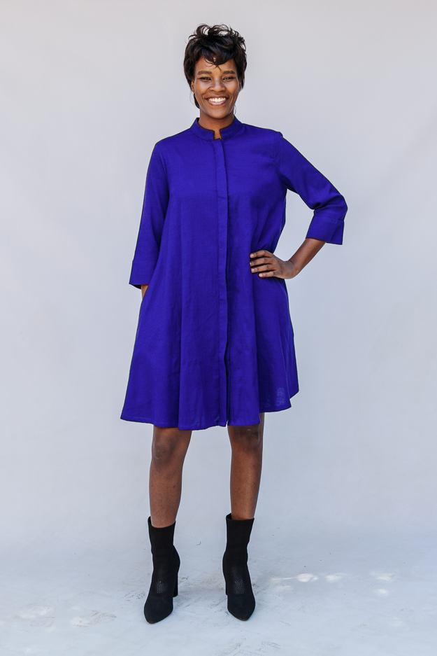 Model wearing deep blue linen dress.