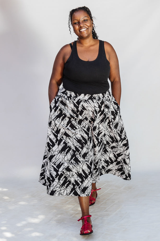 Model wearing black and white abstract culotte.