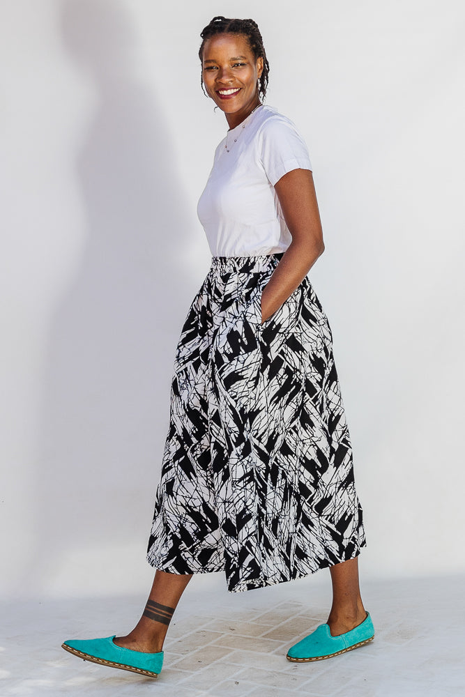 Model wearing black and white abstract culotte.