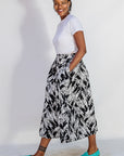Model wearing black and white abstract culotte.