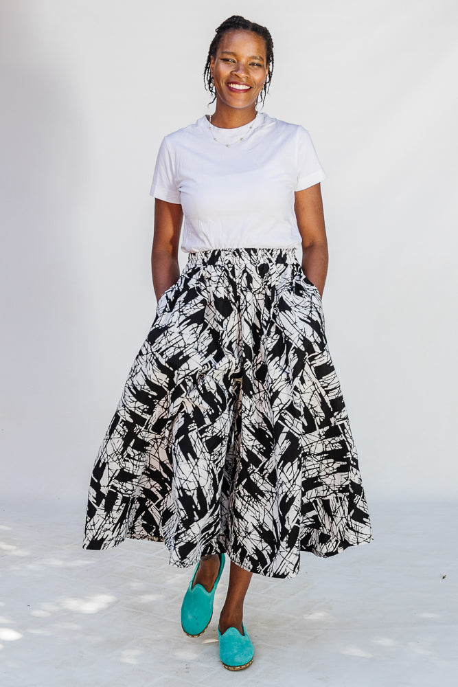 Model wearing black and white abstract culotte.