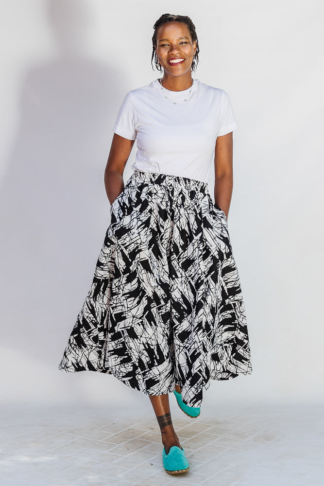 Model wearing black and white abstract culotte.