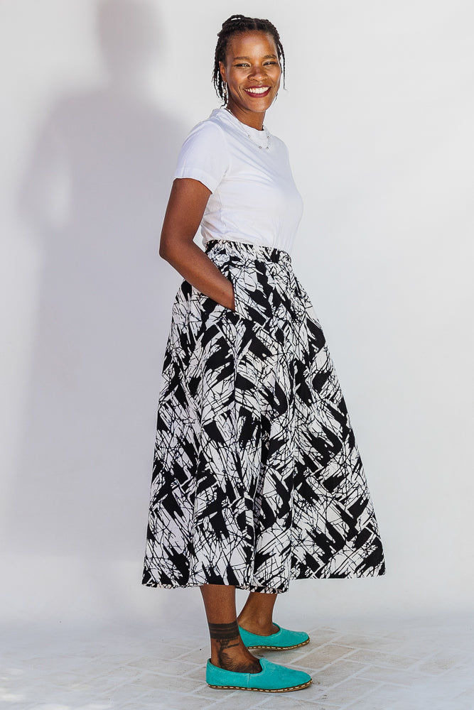 Model wearing black and white abstract culotte.