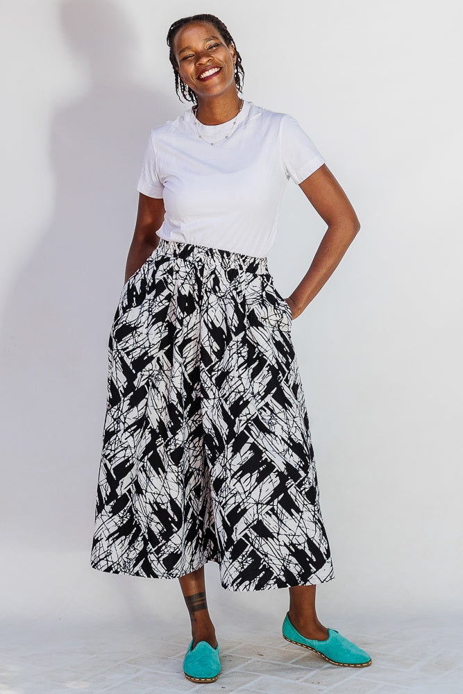 Model wearing black and white abstract culotte.