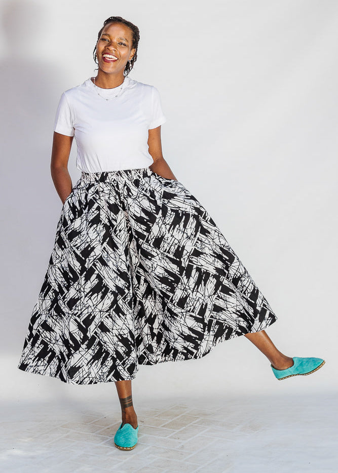 Model wearing black and white abstract culotte.