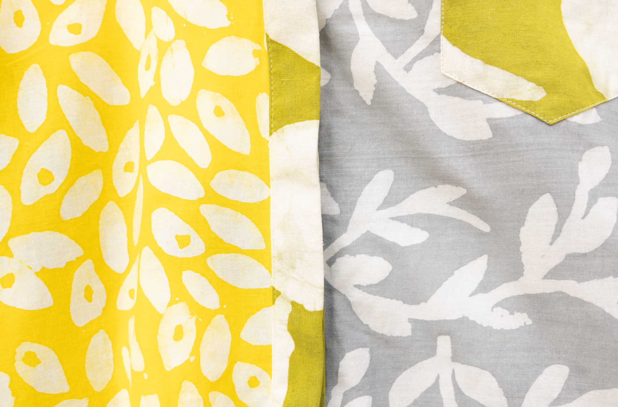 Close up display of mutlicolored batik shortsleeved shirt, fabric.