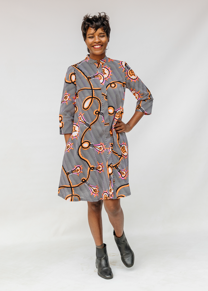 Model wearing black and white light bulb print dress.