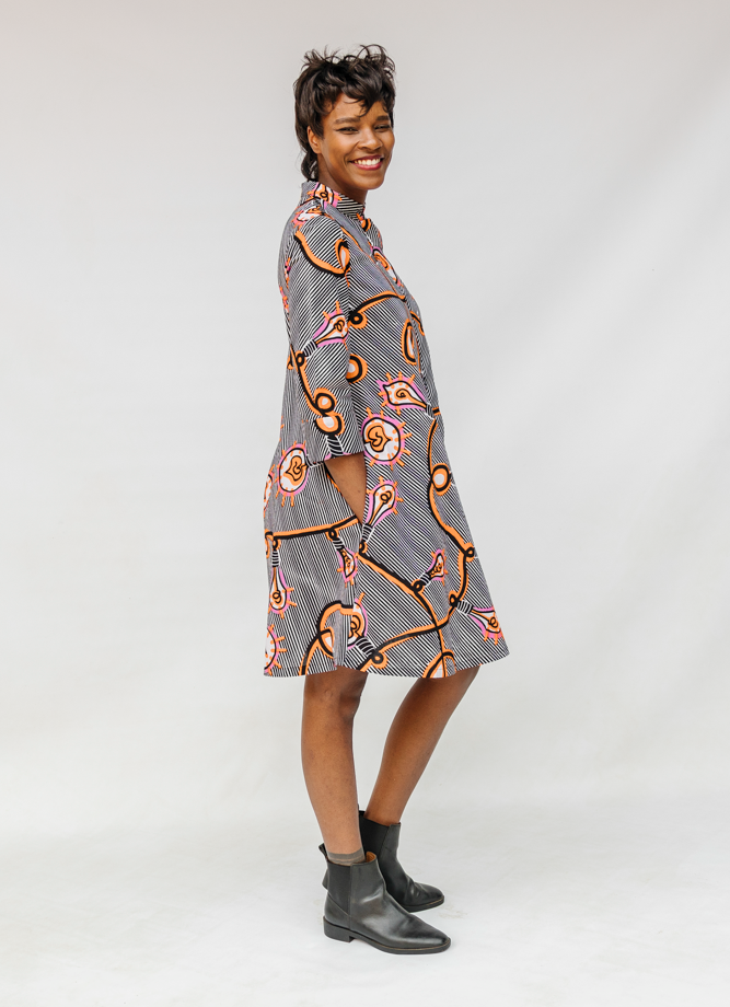 Model wearing black and white light bulb print dress.