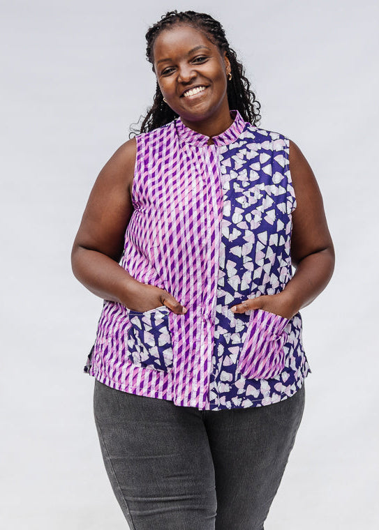 Model wearing purple, pink and white geometric print, patchwork sleeveless shirt.
