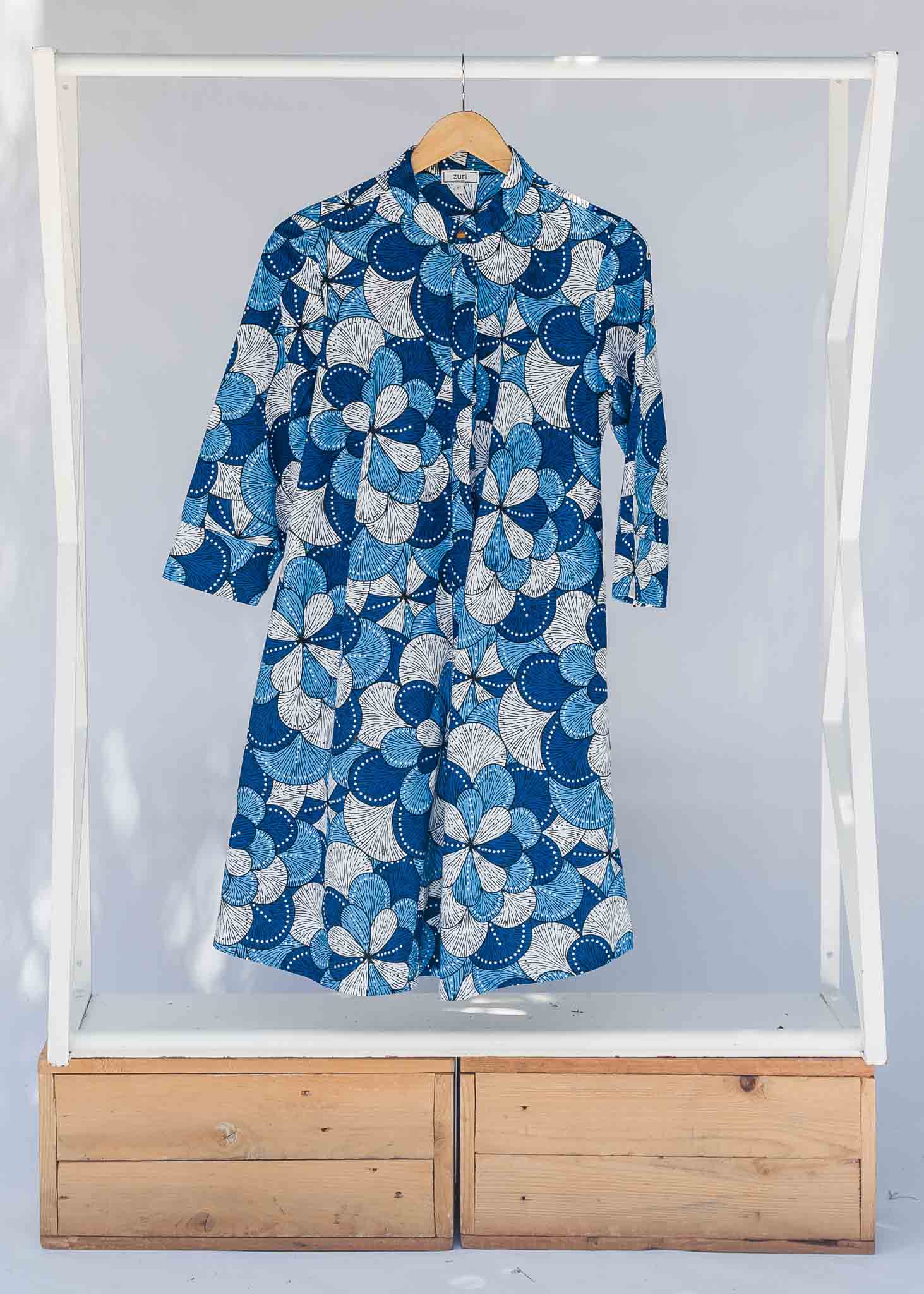 Display of blue and white floral print dress.