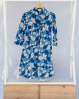 Display of blue and white floral print dress.