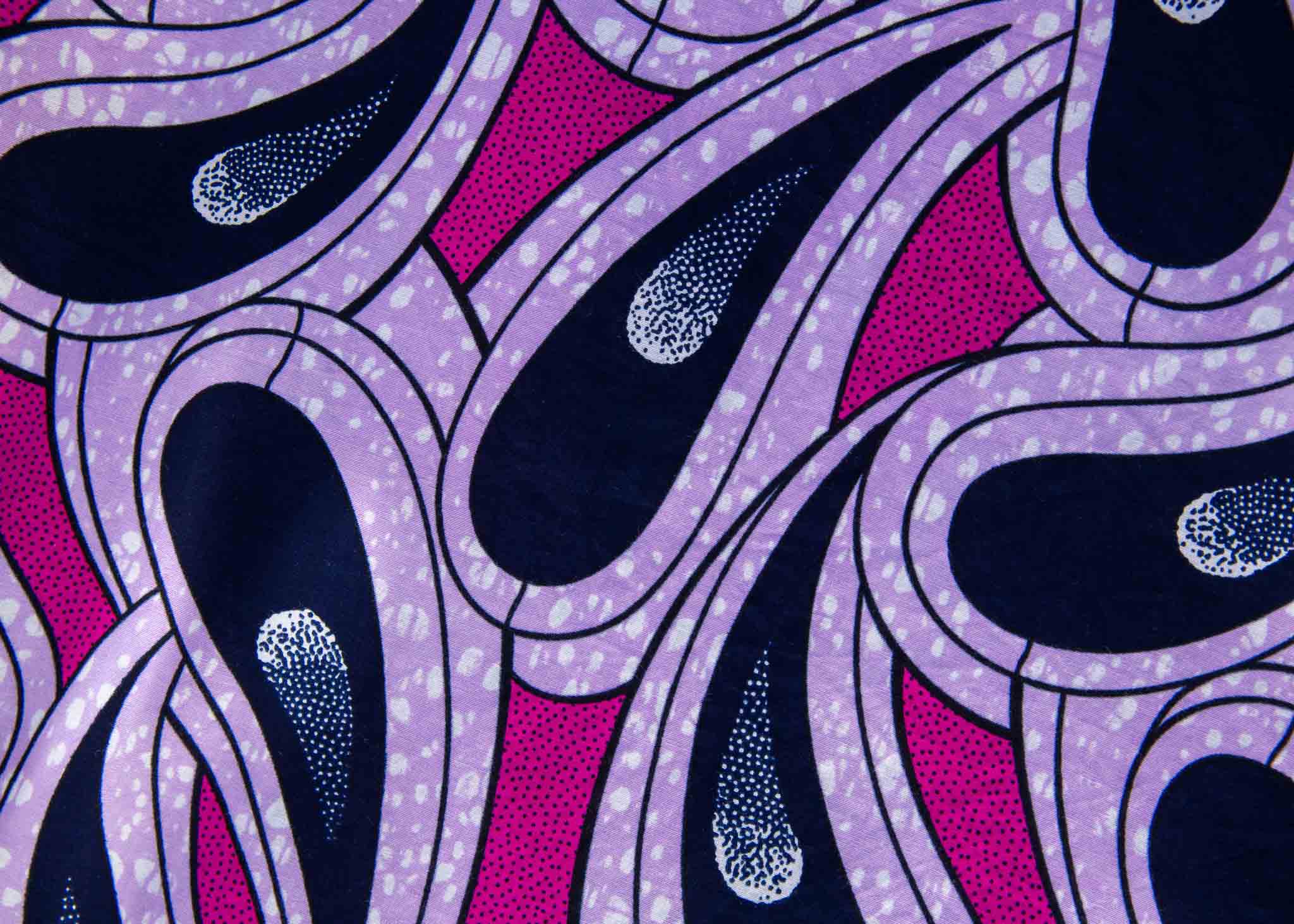 Display of purple and pink geometric print dress.