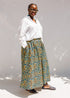 Model wearing white shirt and rainbow culotte.