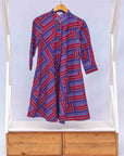 a blue, red and lavender geometric shirt dress