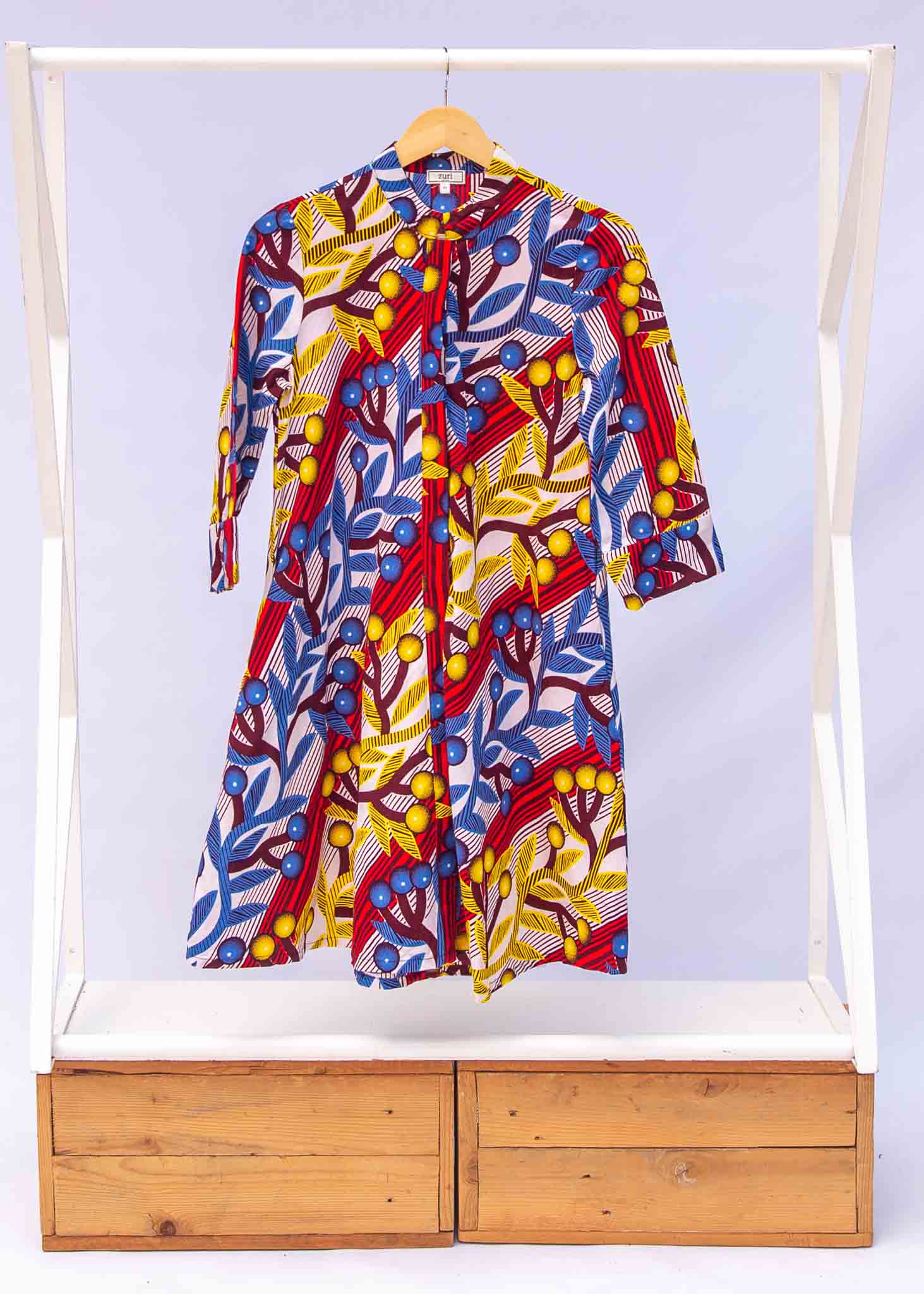 a yellow, red, blue and white vine design shirt dress