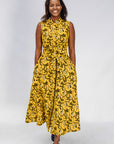 Model wearing yellow dress with black and white paisley print.