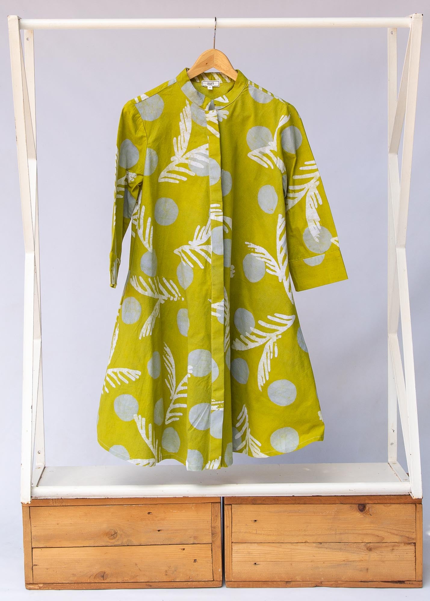 Display of olive-green, white and green batik dress