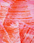 Close up display of orange, pink and white brushstrokes batik dress 