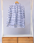 Display of gray and white striped batik shirt