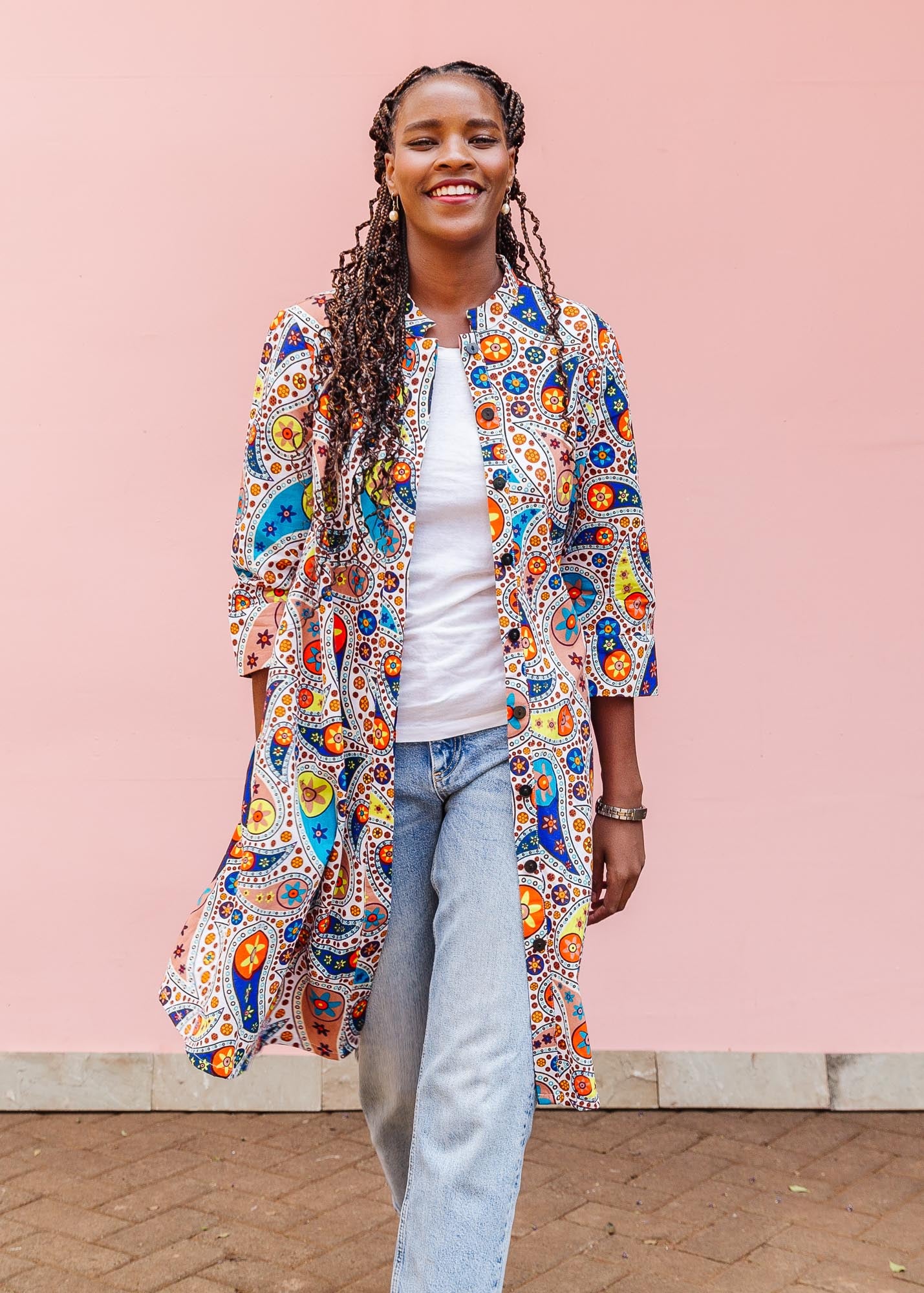 The model is wearing multi-colored paisley print 