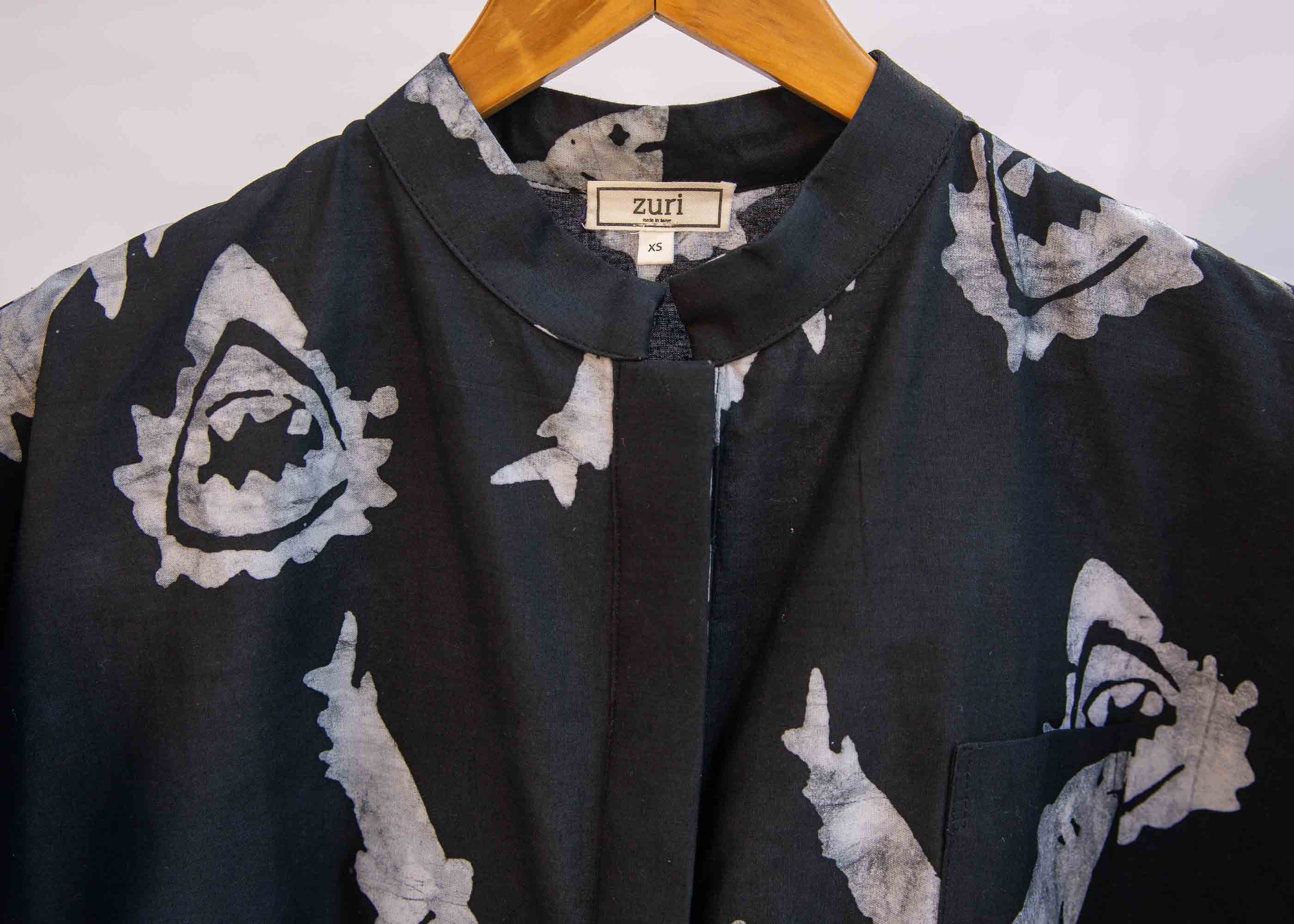 display of a black and white shark print tee shirt