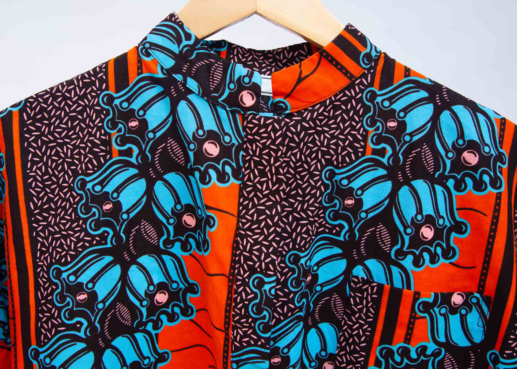 Display of orange and blue floral shirt.