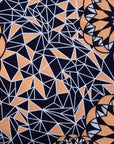 detail of a black, apricot and white geometric design shirt dress